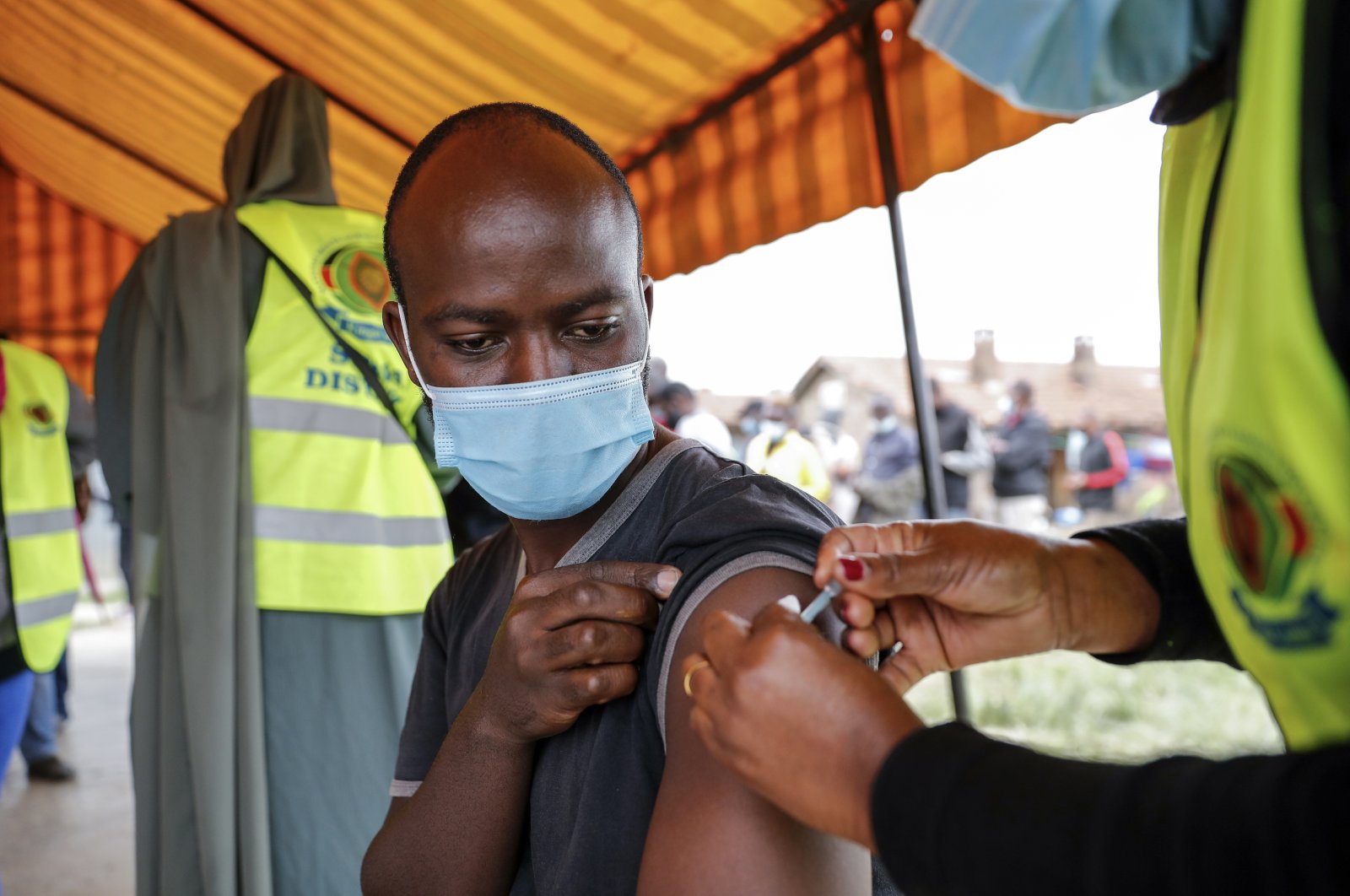 A Kenyan man receives a dose of the AstraZeneca COVID-19 vaccine donated by Britain, at the Makongeni Estate in Nairobi, Kenya, Aug. 14, 2021. (AP Photo)