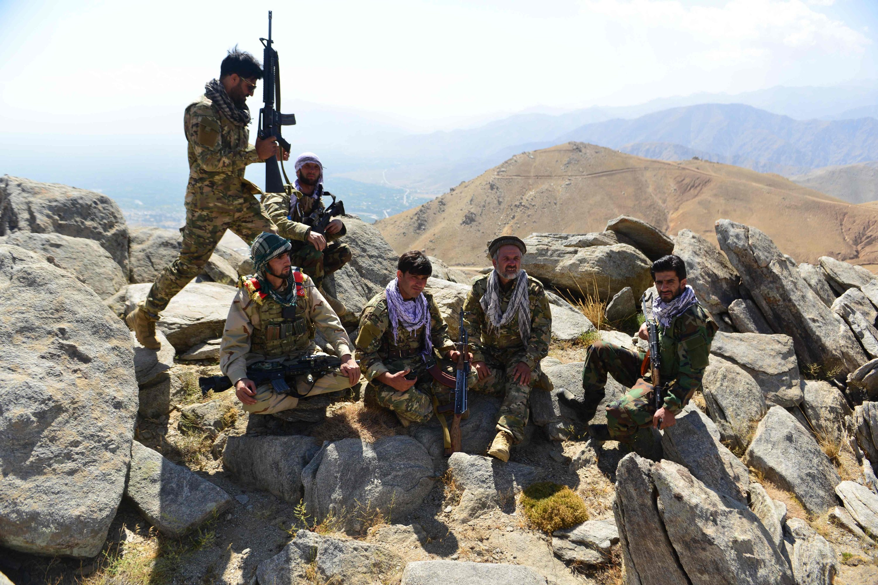Afghan resistance movement and anti-Taliban uprising forces take rest as they patrol on a hilltop in Darband area in Anaba district, Panjshir province, Afghanistan, Sept. 1, 2021. (AFP Photo)