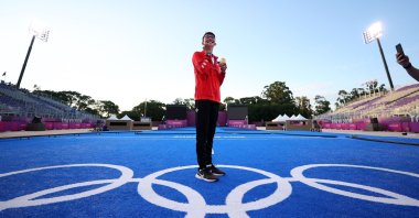 Taking first place, Turkey's national archer Mete Gazoz celebrates on the podium of the men's individual competition at the 2020 Tokyo Olympics, Tokyo, Japan, July 31, 2021. (AP Photo)