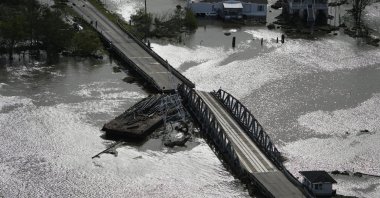 A barge damages a bridge that divides Lafitte, La., and Jean Lafitte, in the aftermath of Hurricane Ida, Aug. 30, 2021, in Lafitte, La. (AP Photo)