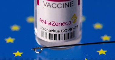 A vial labeled "AstraZeneca COVID-19 vaccine" placed on an EU flag is seen in this illustration picture taken on March 24, 2021. (Reuters Photo)