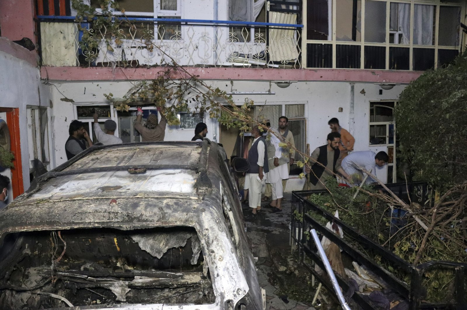 Afghan people are seen inside a house after U.S. drone strike in Kabul, Afghanistan, Aug. 29, 2021. (AP Photo)