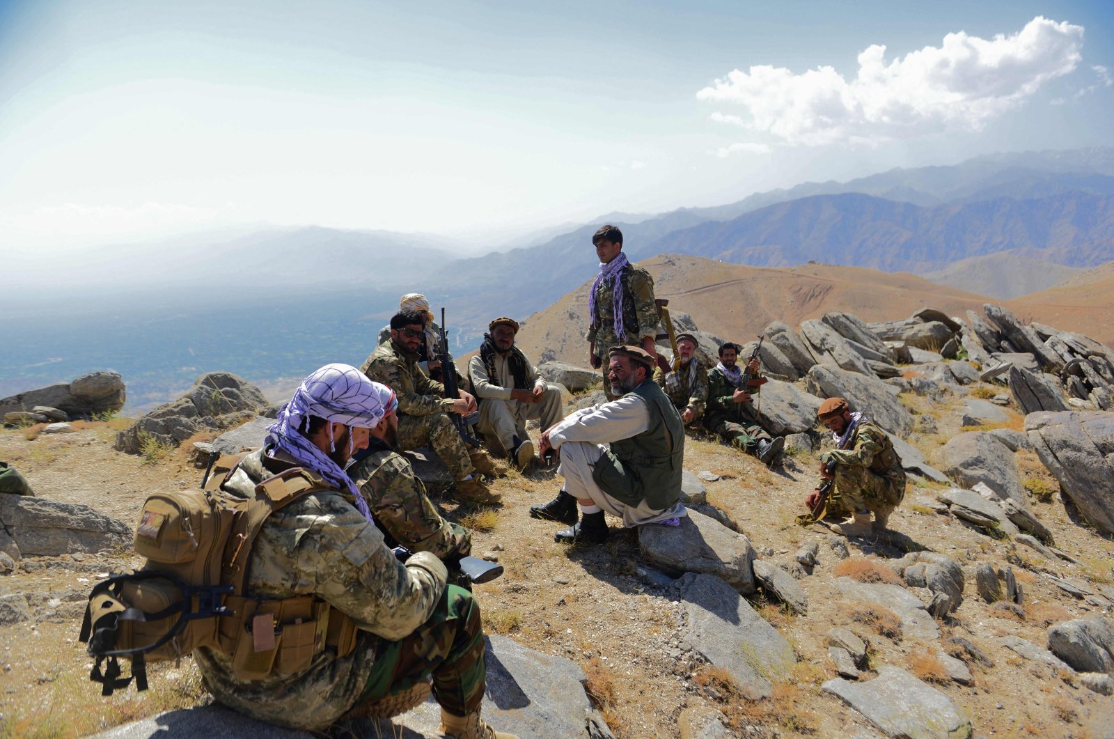 Afghan resistance movement and anti-Taliban uprising forces take rest as they patrol on a hilltop in Darband area in Anaba district, Panjshir province, Afghanistan, Sept. 1, 2021. (AFP Photo)