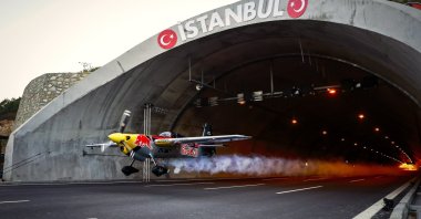 A handout photo made available by the Red Bull Press Office shows Italian pilot Dario Costa in action as he flying through the Çatalça Tunnel in Istanbul, Turkey, Sept. 4, 2021. (EPA Photo)