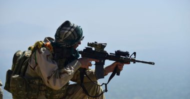 A member of the Afghan resistance movement and anti-Taliban uprising force takes up a postion during a patrol on a hilltop in the Darband area in Anaba district, Panjshir province, Afghanistan, Sept. 1, 2021. (AFP Photo)