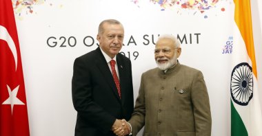 Turkey's President Recep Tayyip Erdoğan, left, shakes hands with India's Prime Minister Narendra Modi, right, prior to their meeting on the sidelines of the G-20 summit in Osaka, Japan, Saturday, June 29, 2019. (Presidential Press Service via AP, Pool)