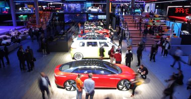 Visitors are pictured at the booth of German car maker Volkswagen at the International Auto Show (IAA), in Frankfurt, Germany, Sept. 11, 2019. (AFP Photo)