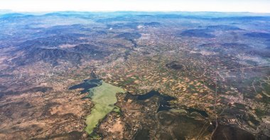 Aerial view of Lake Texcoco, fields and mountains, near Mexico City, Mexico. (Shutterstock Photo)