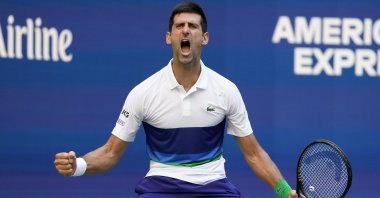 Serbia's Novak Djokovic reacts after scoring a point against Japan's Kei Nishikori in their U.S. Open third-round match, New York, U.S., Sept. 4, 2021. (AP Photo)