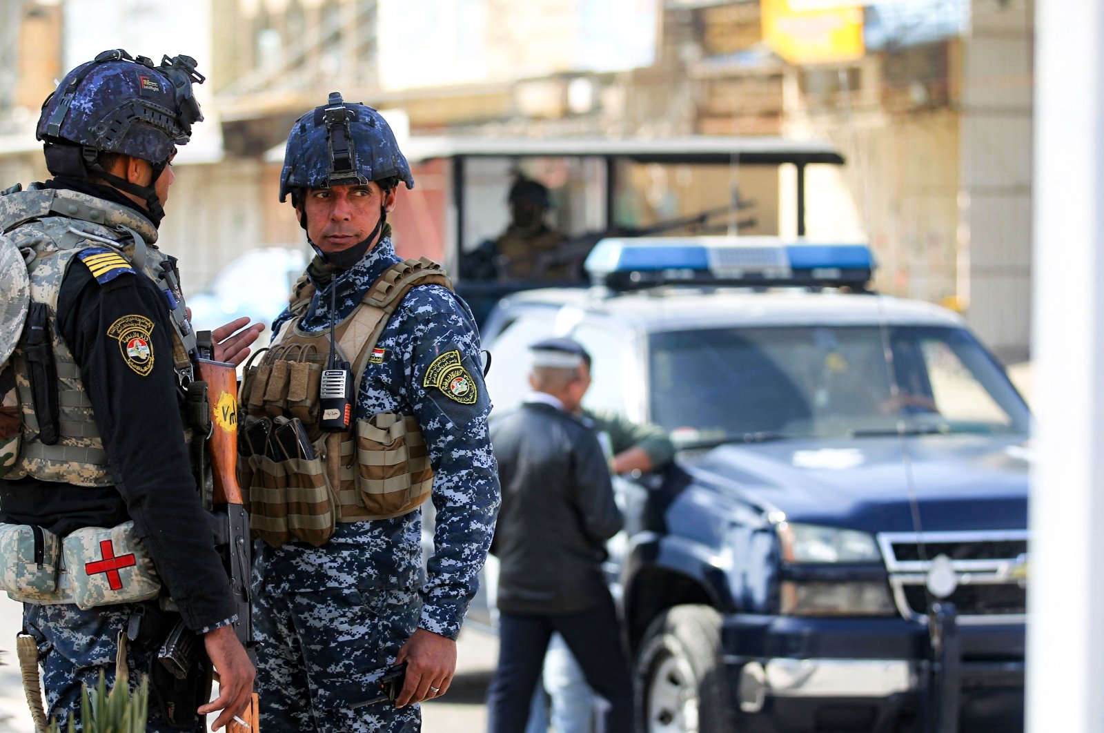 Members of the Iraqi federal police force stand guard at a checkpoint in a street in the capital during tightened security measures, Baghdad, Iraq, Jan. 29, 2021. (AFP File Photo)