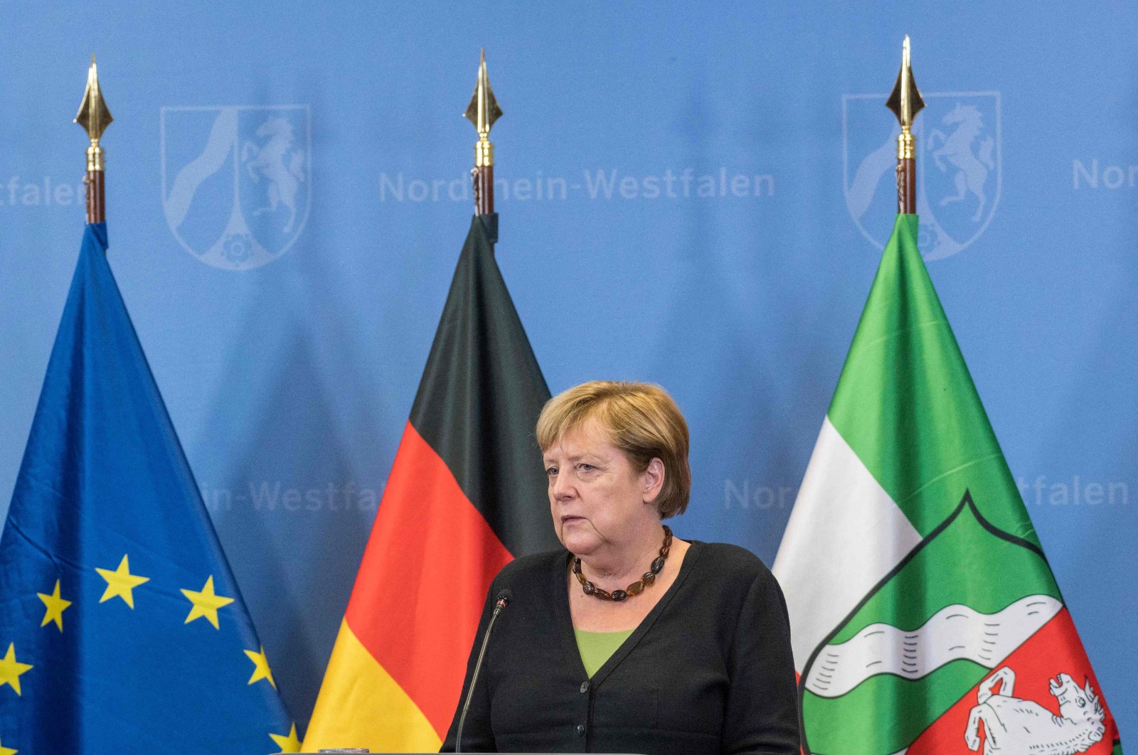 German Chancellor Angela Merkel looks on as she addresses a joint press conference with the North Rhine-Westphalia's State Premier and Germany's conservative Christian Democratic Union's (CDU) chancellor candidate after visiting flood-hit regions in Hagen, North Rhine-Westphalia, western Germany, Sept. 5, 2021. (AFP Photo)