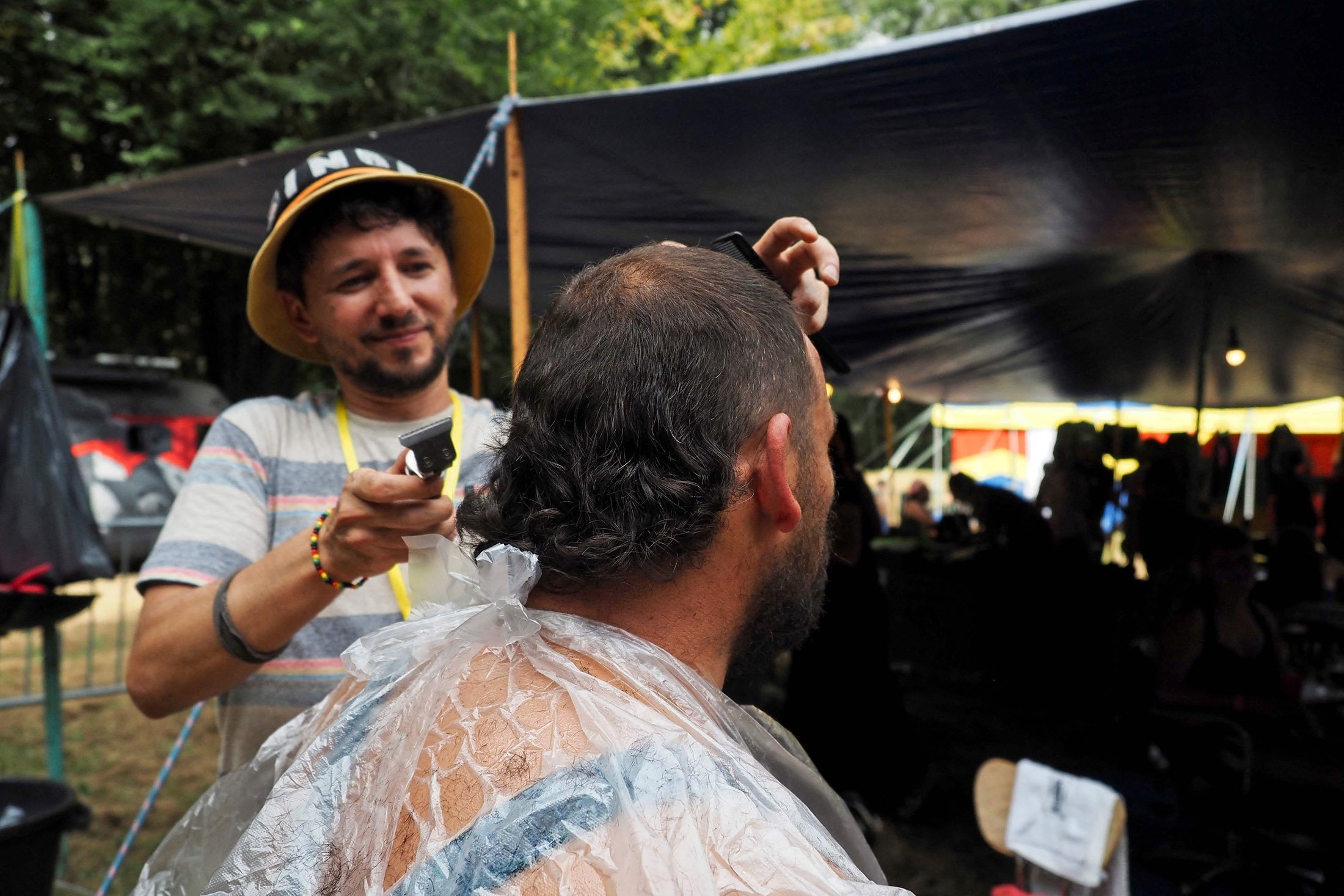 A competitor in the 2021 Mullet Cup gets a haircut during the European mullet haircut festival in Cheniers, central France, Sept. 4, 2021. (AFP Photo)