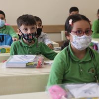 Students wearing protective masks sit inside a classroom at a school in Bağcılar district, Istanbul, Turkey, Sept. 6, 2021. (AA Photo)