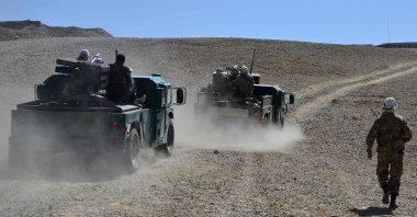 The Afghan resistance movement and anti-Taliban uprising forces personnel patrol in armored humvees at an outpost in Kotal-e Anjuman of the Paryan district in Panjshir province, Afghanistan, Aug. 23, 2021. (AFP Photo)