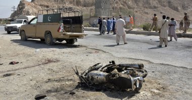 Security officials examine the site of suicide bombing in a checkpoint on the outskirts of Quetta, Pakistan, Sept. 5, 2021. (AP Photo)