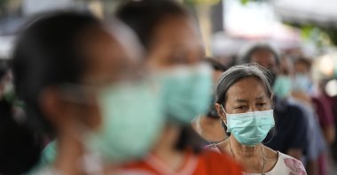 People wait for food supplies distributed from Bangkok Community Help Foundation in Bangkok, Thailand, Aug. 31, 2021. (AP Photo)