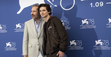 Denis Villeneuve (L), and Timothee Chalamet pose for photographers at the photocell for the film “Dune” at the 78th Venice Film Festival, in Venice, Italy, Sept. 3, 2021. (AP Photo)
