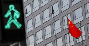 A Chinese national flag flutters outside the China Securities Regulatory Commission (CSRC) building on the Financial Street in Beijing, China, July 9, 2021. (Reuters Photo)