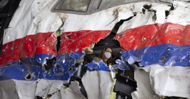 Trial judges and lawyers view the reconstructed wreckage of Malaysia Airlines Flight MH17, at the Gilze-Rijen military air base, southern Netherlands, May 26, 2021. (AP Photo)