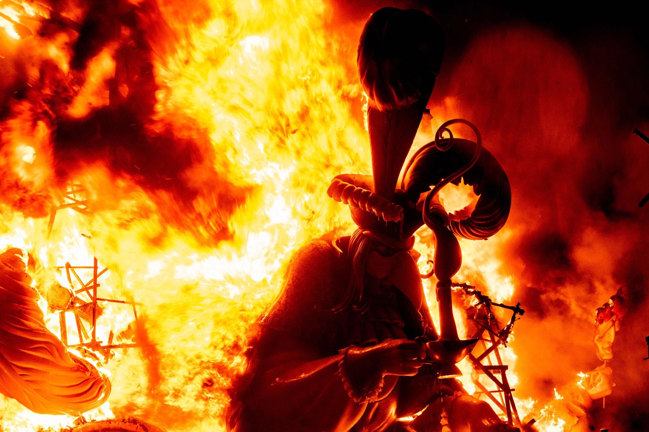 A ninot burns as an installation of the Fallas festival is set on fire during the last night of the festival in Valencia, Spain, Sept. 5, 2021. (AFP Photo)