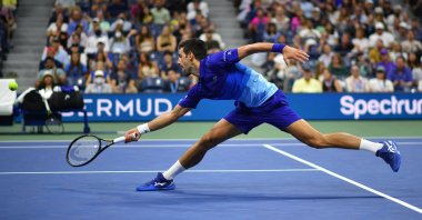 Serbia's Novak Djokovic hits a return to U.S.' Jenson Brooksby during their 2021 U.S. Open men's singles fourth-round match, New York, U.S., Sept. 6, 2021. (AFP Photo)