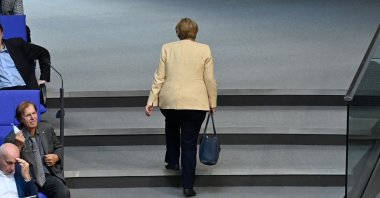 German Chancellor Angela Merkel leaves the plenary hall during a session at the Bundestag, the German lower house of parliament, in Berlin, Germany, Sept. 7, 2021. (AFP Photo )
