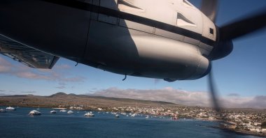 An Ecuadorian navy aircraft prepares to land in San Cristobal after a fishing fleet of mostly Chinese-flagged ships was detected in an international corridor that borders the Galapagos Islands' exclusive economic zone, in San Cristobal, Galapagos Islands, Ecuador, Aug. 7, 2020. (REUTERS/Santiago Arcos)