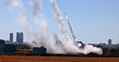 Israel's Iron Dome aerial defence system is activated to intercept a rocket launched from the Gaza Strip, controlled by the Palestinian Hamas movement, above the southern Israeli city of Ashdod, on May 12, 2021. (AFP Photo)