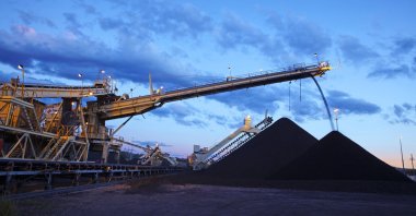 Coal loading operations proceed at Coal and Allied's Mount Thorley Warkworth mine in the Hunter Valley about 140 kilometers (87 miles) north of Sydney, Oct. 18, 2010. (Reuters Photo/Rio Tinto/Handout)