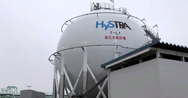 The logo of the CO2-free Hydrogen Energy Supply-chain Technology Research Association (HySTRA) is seen on a liquefied hydrogen storage tank built by Kawasaki Heavy Industries at the hydrogen receiving terminal at the Kobe Airport Island in Kobe, western Japan, Jan. 22, 2021. (Reuters Photo)