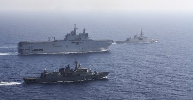 A French Tonnerre helicopter carrier, rear left is escorted by Greek and French military vessels during a maritime exercise in the Eastern Mediterranean, Aug. 13, 2020. (AP Photo)