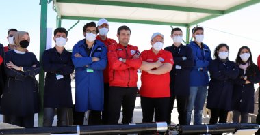 Industry and Technology Minister Mustafa Varank (5th from R) visits competing student teams with an accompanying delegation as part of Teknofest, Aksaray, central Turkey, Sept. 8, 2021. (AA Photo)