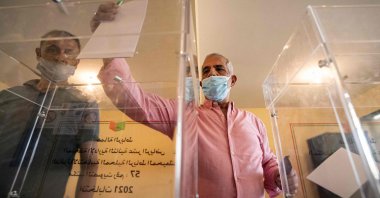 A voter casts a ballot during Morocco's parliamentary and local elections in the capital Rabat, Morocco, on Sept. 8, 2021. (Fadel Senna / AFP)