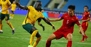 Vietnam's Nguyen Thanh Binh (R) in action against Australia's Awer Mabil (L) during the final round of the 2022 FIFA World Cup Asian qualifiers in Hanoi, Vietnam, Sept. 7, 2021. (EPA Photo)