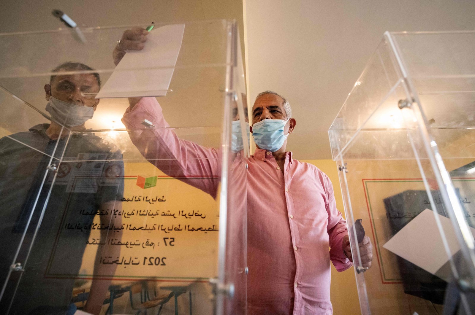 A voter casts a ballot during Morocco's parliamentary and local elections in the capital Rabat, Morocco, on Sept. 8, 2021. (Fadel Senna / AFP)