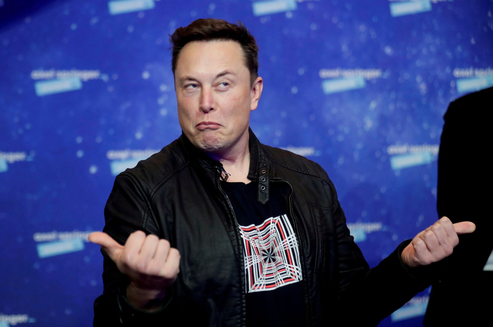 SpaceX owner and Tesla CEO Elon Musk grimaces after arriving on the red carpet for the Axel Springer award, in Berlin, Germany, Dec. 1, 2020. (REUTERS Photo)