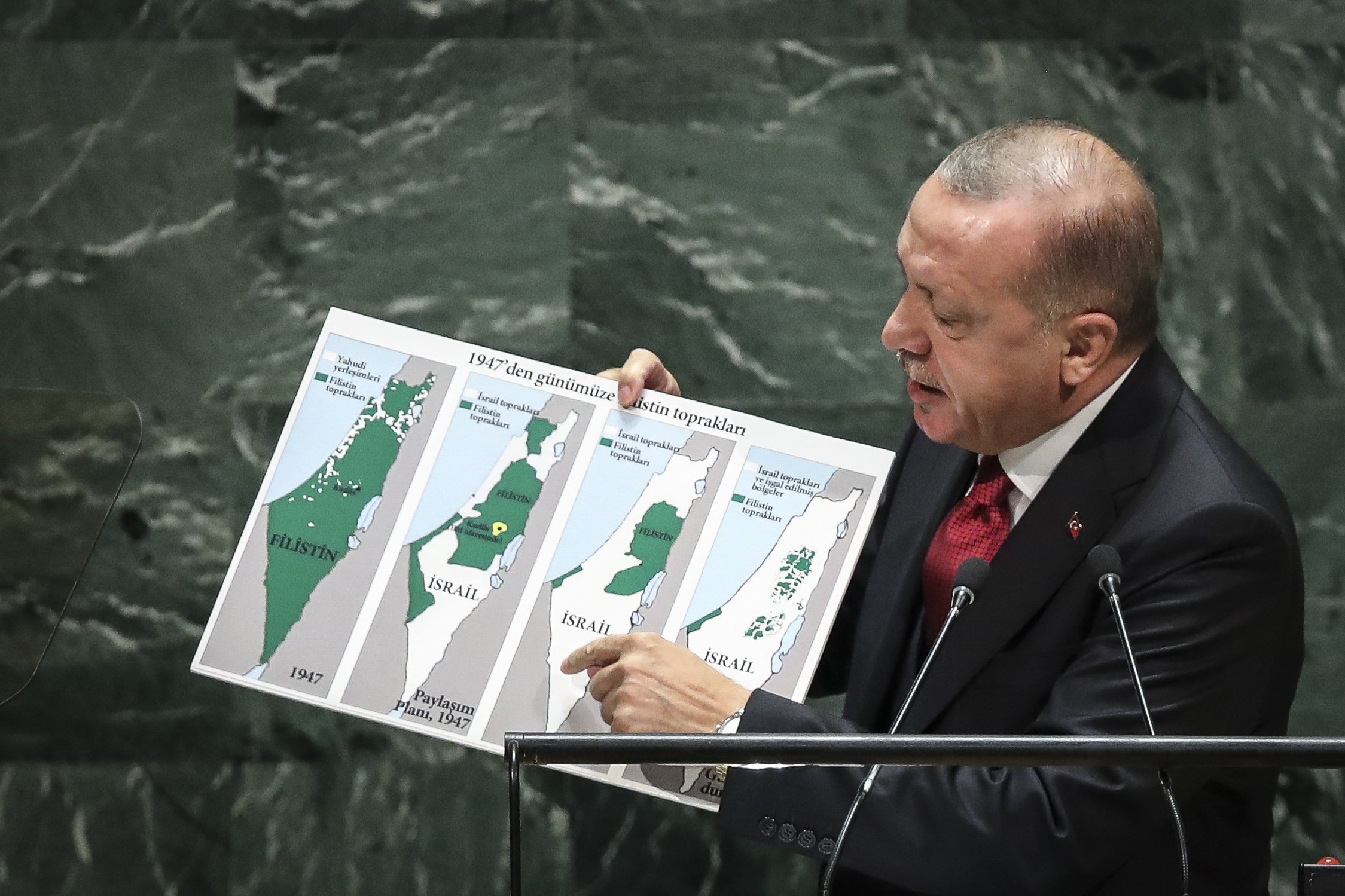 President Recep Tayyip Erdogan holds up a map of Israel since 1947 showing changing population of territory under Israeli rule while speaking to the U.N. General Assembly at U.N. headquarters, New York City, U.S., Sept. 24, 2019. (Photo by Getty Images)
