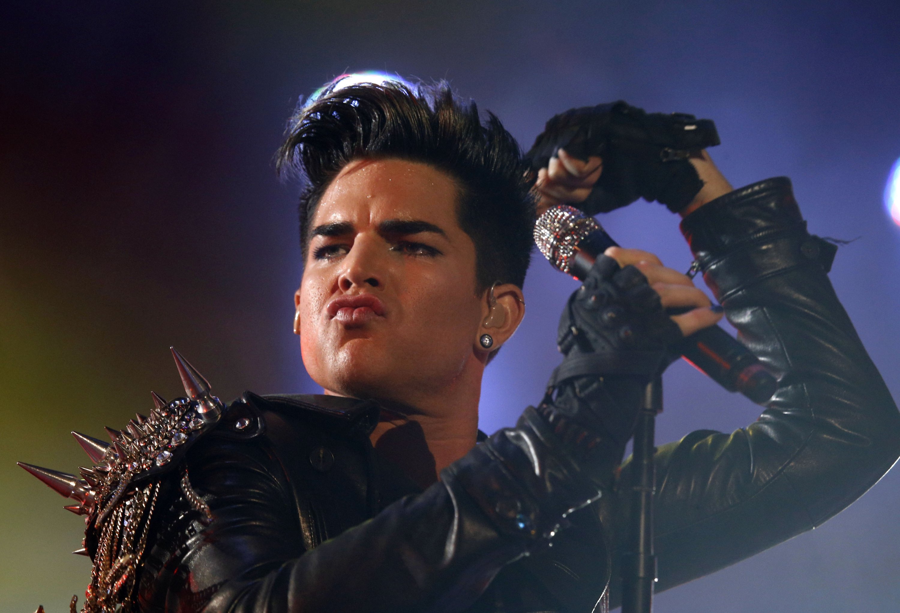 Adam Lambert and the rock group Queen perform in a fan zone during the Euro 2012 soccer championship tournament in Kiev, Ukraine, June 30, 2012. (AP Photo)