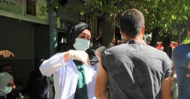 A man gets vaccinated at a vaccination point on a street in Bingöl, eastern Turkey, Sept. 8, 2021. (İHA PHOTO)