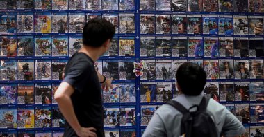 People look at console games at a store in Beijing, China, Aug. 31, 2021. (AFP Photo)