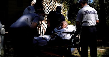 Paramedics prepare to transport a man suffering from possible COVID-19 symptoms in McLoud, Oklahoma, U.S., Sept. 8, 2021. (Reuters Photo)