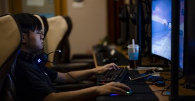 A man plays games in the video gaming center in Shanghai, China, Aug. 31, 2021. (EPA Photo)