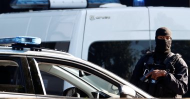French police secure the Paris courthouse during the arrival of a convoy believed to be carrying the defendants standing trial over Paris' November 2015 attacks, in Paris, France, Sept. 8, 2021. (Reuters Photo)