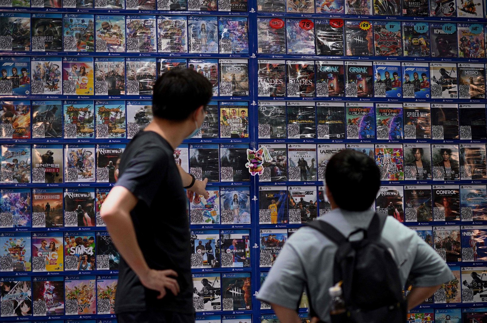 People look at console games at a store in Beijing, China, Aug. 31, 2021. (AFP Photo)