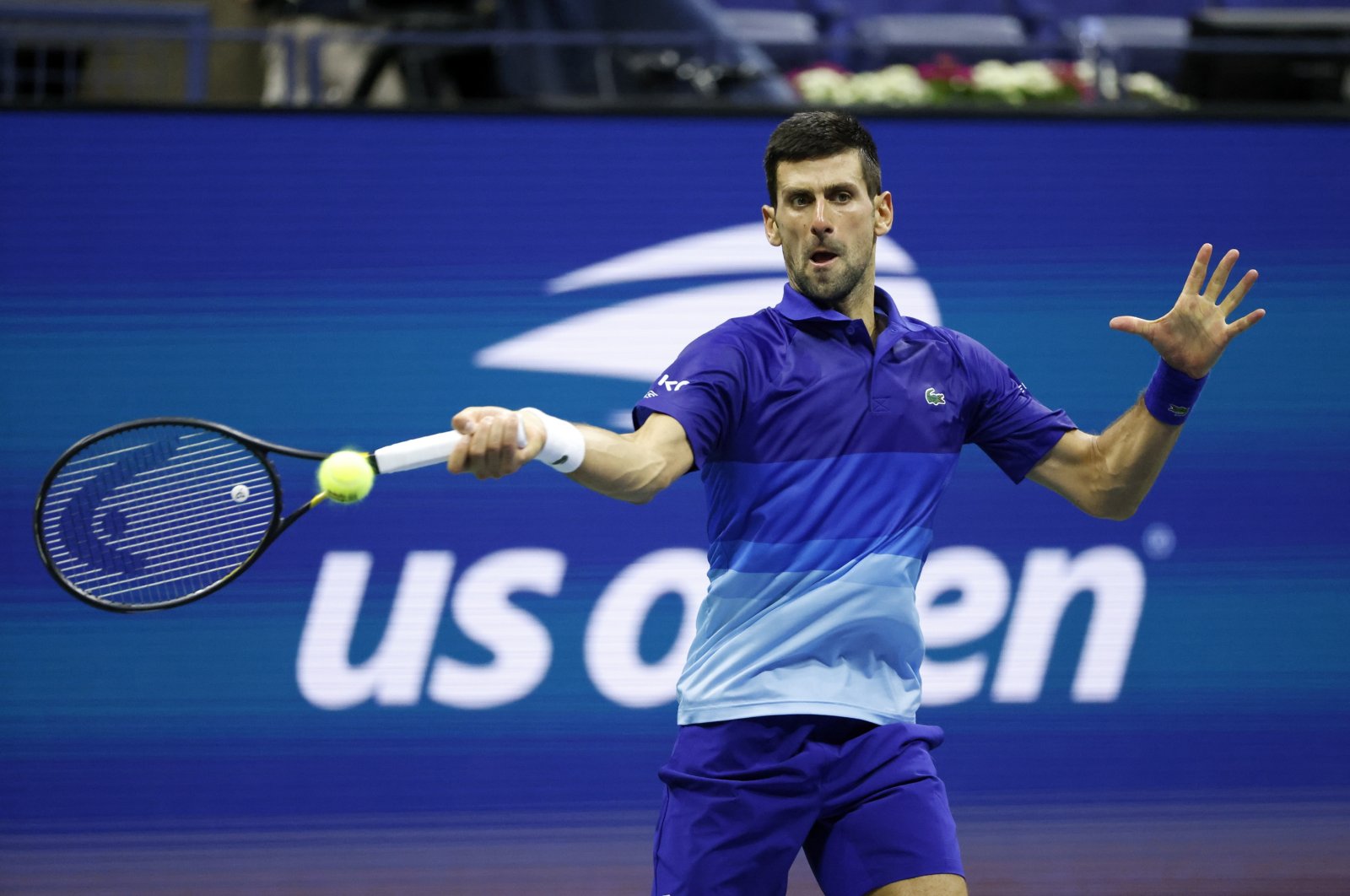 Serbia's Novak Djokovic hits a return to Italy's Matteo Berrettini during their U.S. Open quarterfinal match, New York, U.S., Sept. 2021. (EPA Photo)