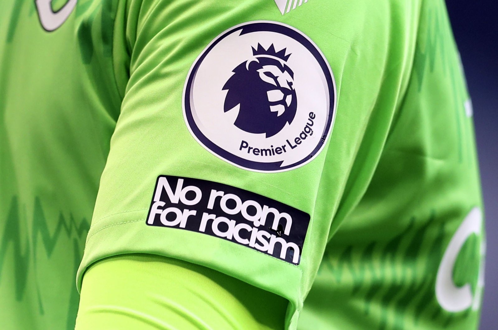 The "No Room For Racism" logo on Everton goalkeeper Jordan Pickford's shirt during a Premier League match against Tottenham Hotspur, London, England, Sept. 13, 2020. (AP Photo)