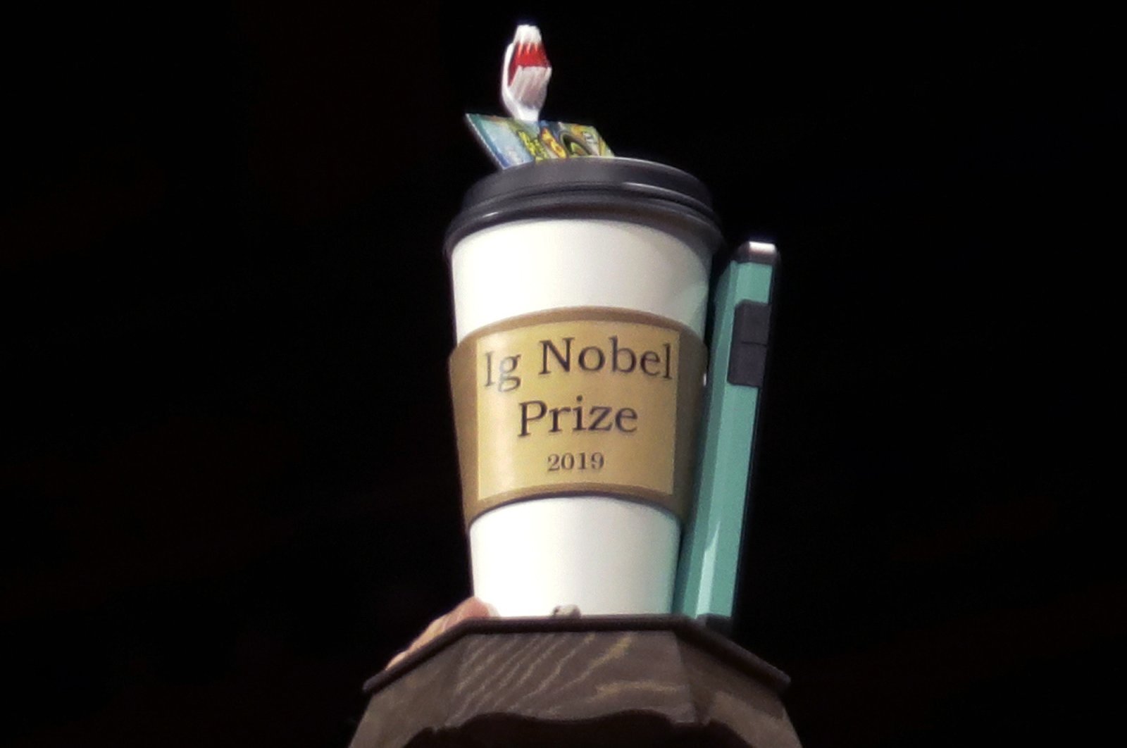 The 2019 Ig Nobel award is displayed at the 29th annual Ig Nobel awards ceremony at Harvard University in Cambridge, Massachusetts, U.S., Sept. 12, 2019. The spoof prizes for weird and sometimes head-scratching scientific achievement will be presented online in 2021 due to the coronavirus pandemic. (AP Photo/Elise Amendola, File)