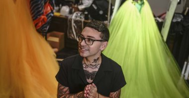 Christian Siriano speaks during a backstage interview before unveiling his latest fashion during New York's Fashion Week, New York, U.S., Sept. 7, 2021. (AP Photo)