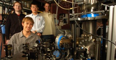Florian Adler (L), Jun Ye (C), Matthew Kirchner (R) and seated Michael Thorpe pose in front of their optical frequency comb molecule detection system at the University of Colorado, in Boulder, Colorado, U.S. (Getty Images)