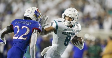 Coastal Carolina Chanticleers wide receiver Jaivon Heiligh (6) moves the ball against Kansas Jayhawks cornerback Duece Mayberry (22) during action in the first quarter at Brooks Stadium, Conway, South Carolina, U.S., Sept. 10, 2021. (USA TODAY Sports via Reuters)